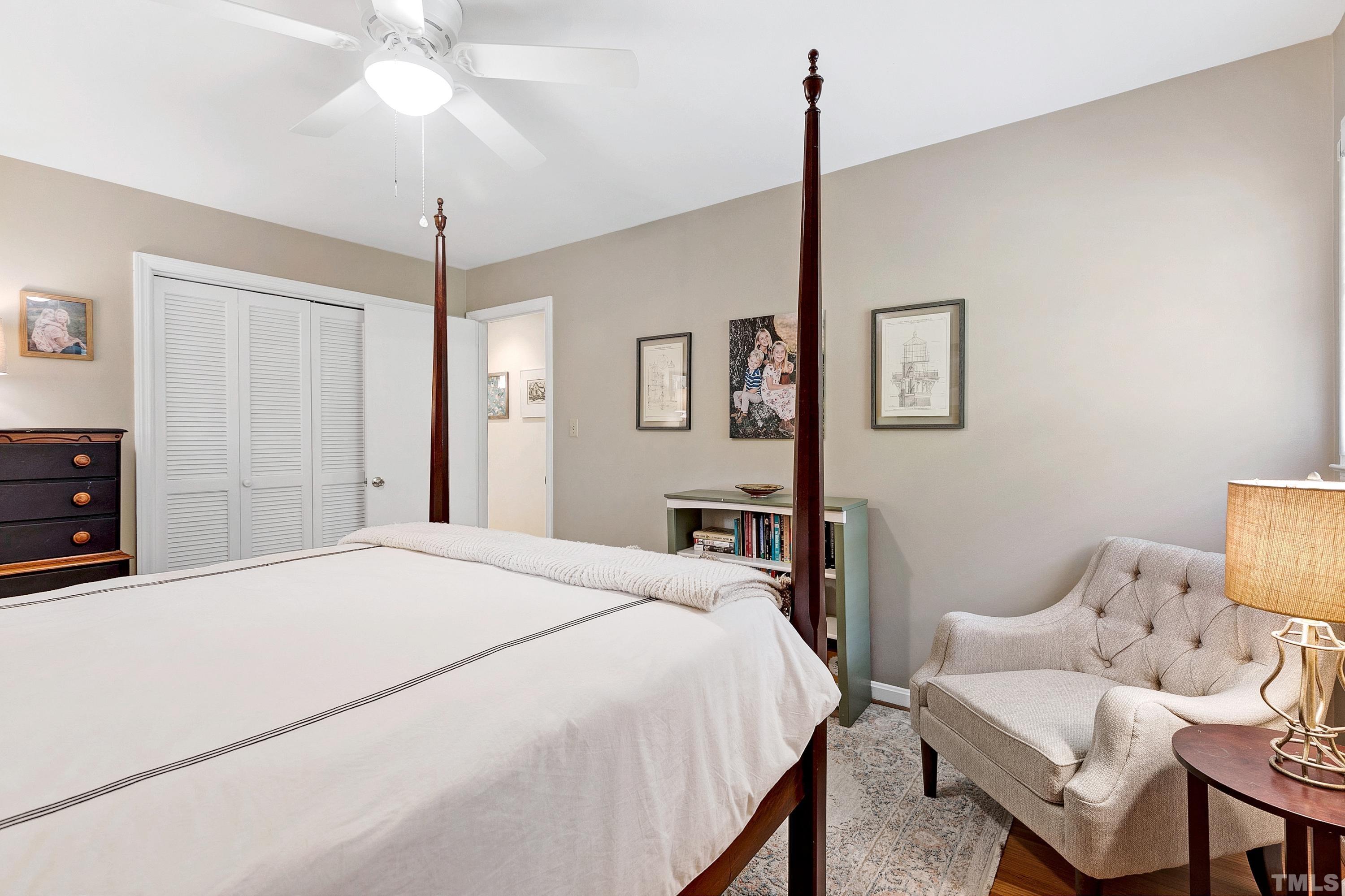 1300 Kingston Ridge Road Cary, NC 27511 - Photo 14 of 40 a spacious bedroom with a bed and a chandelier