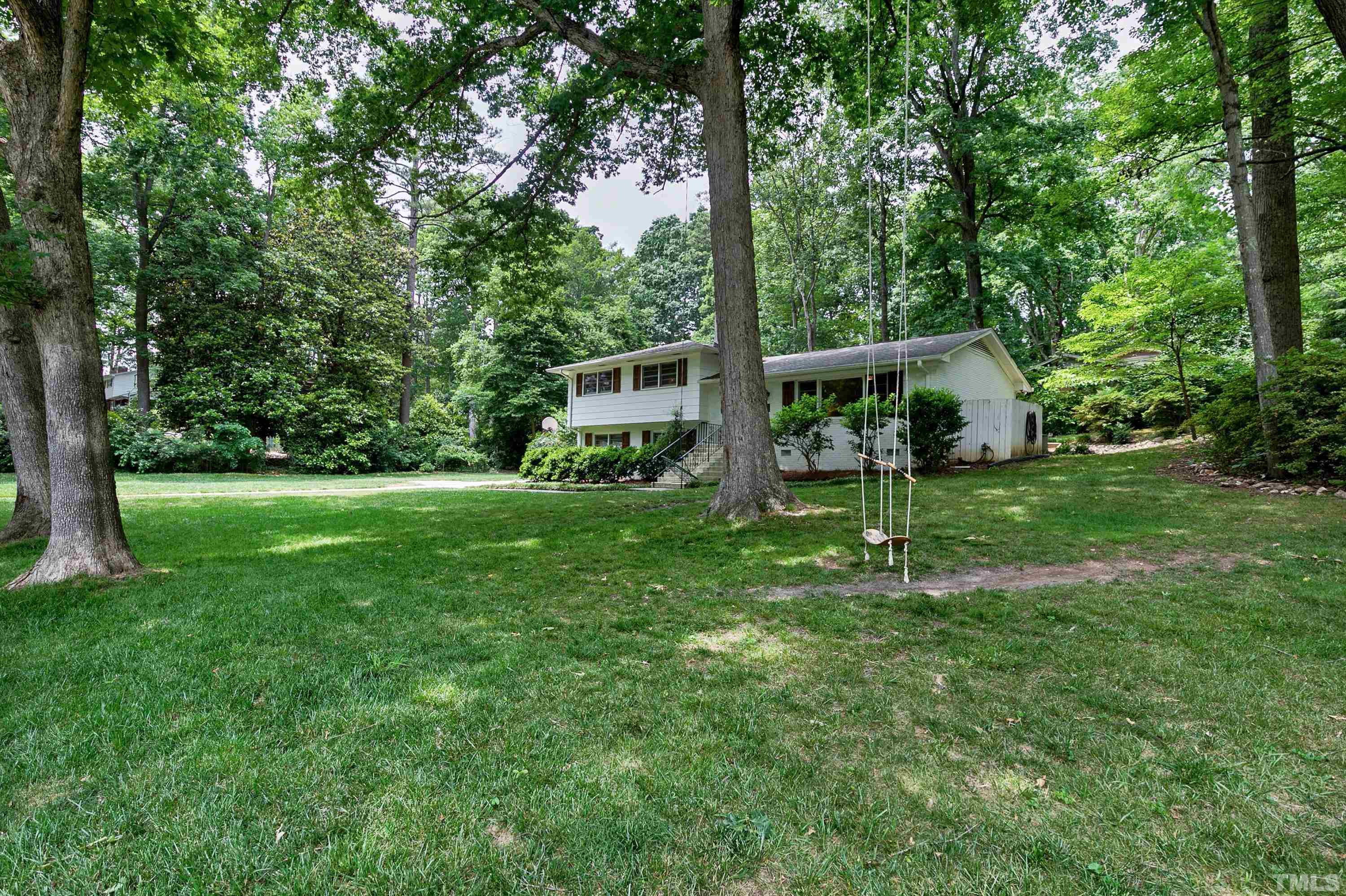 1300 Kingston Ridge Road Cary, NC 27511 - Photo 2 of 40 a view of an house with backyard and a tree