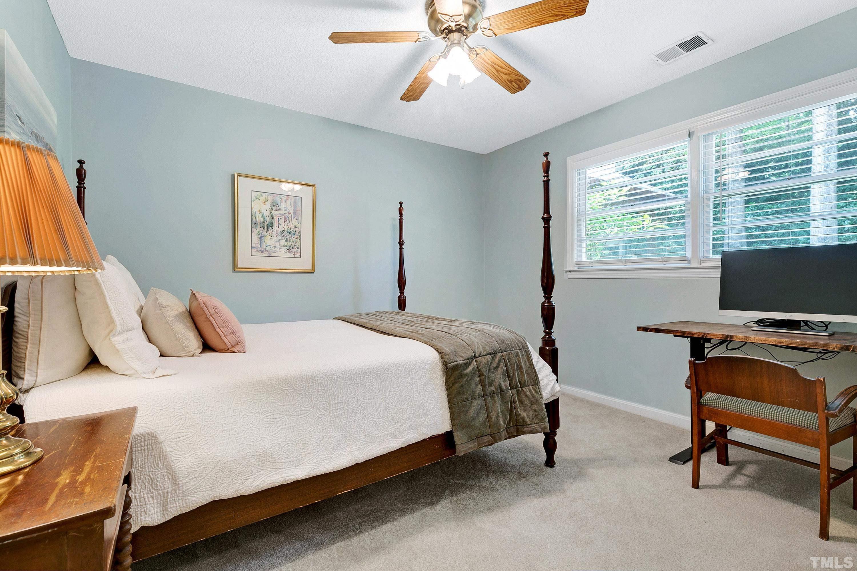 1300 Kingston Ridge Road Cary, NC 27511 - Photo 22 of 40 a bedroom with a bed and a window