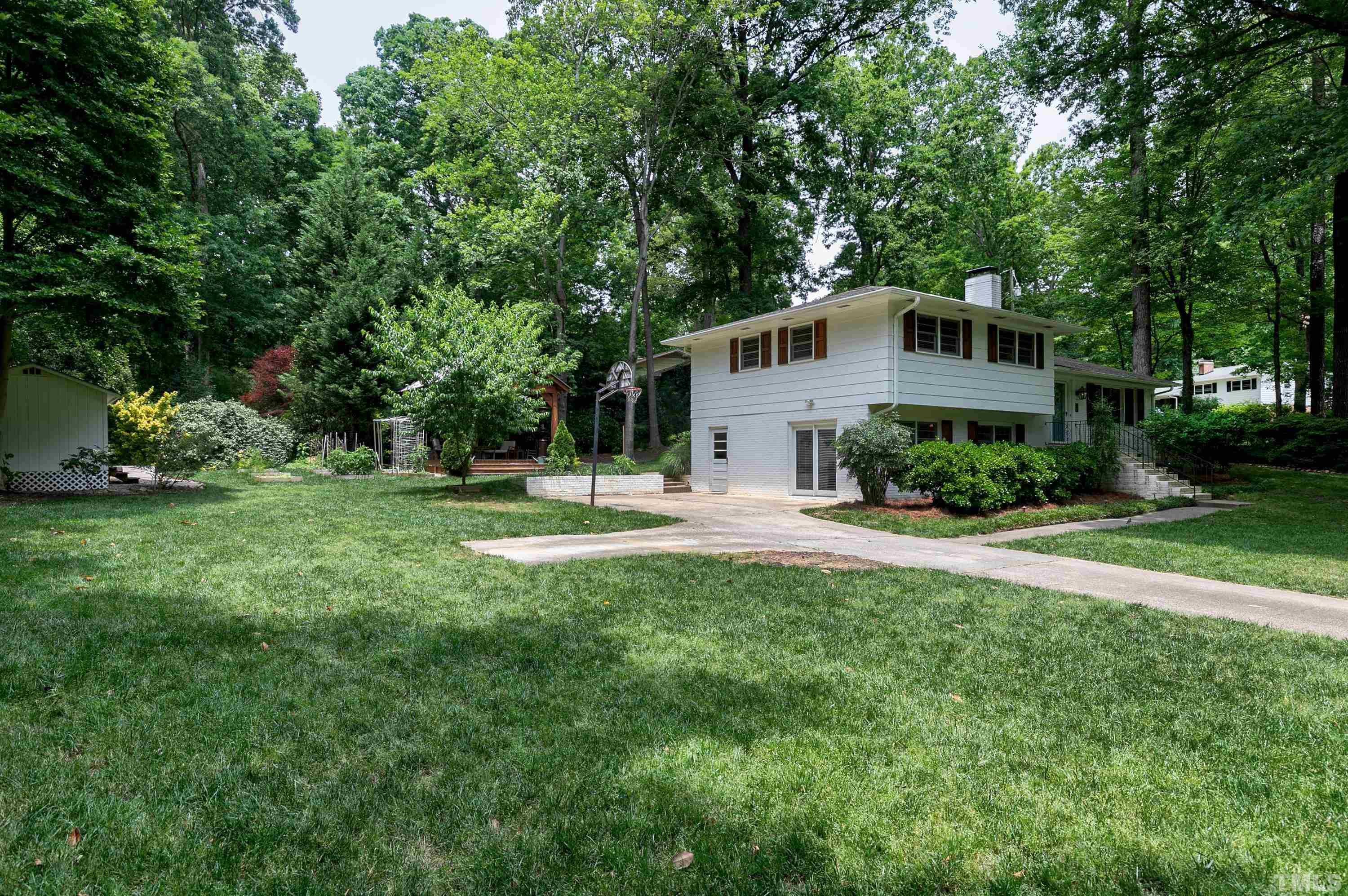 1300 Kingston Ridge Road Cary, NC 27511 - Photo 26 of 40 a front view of a house with a yard