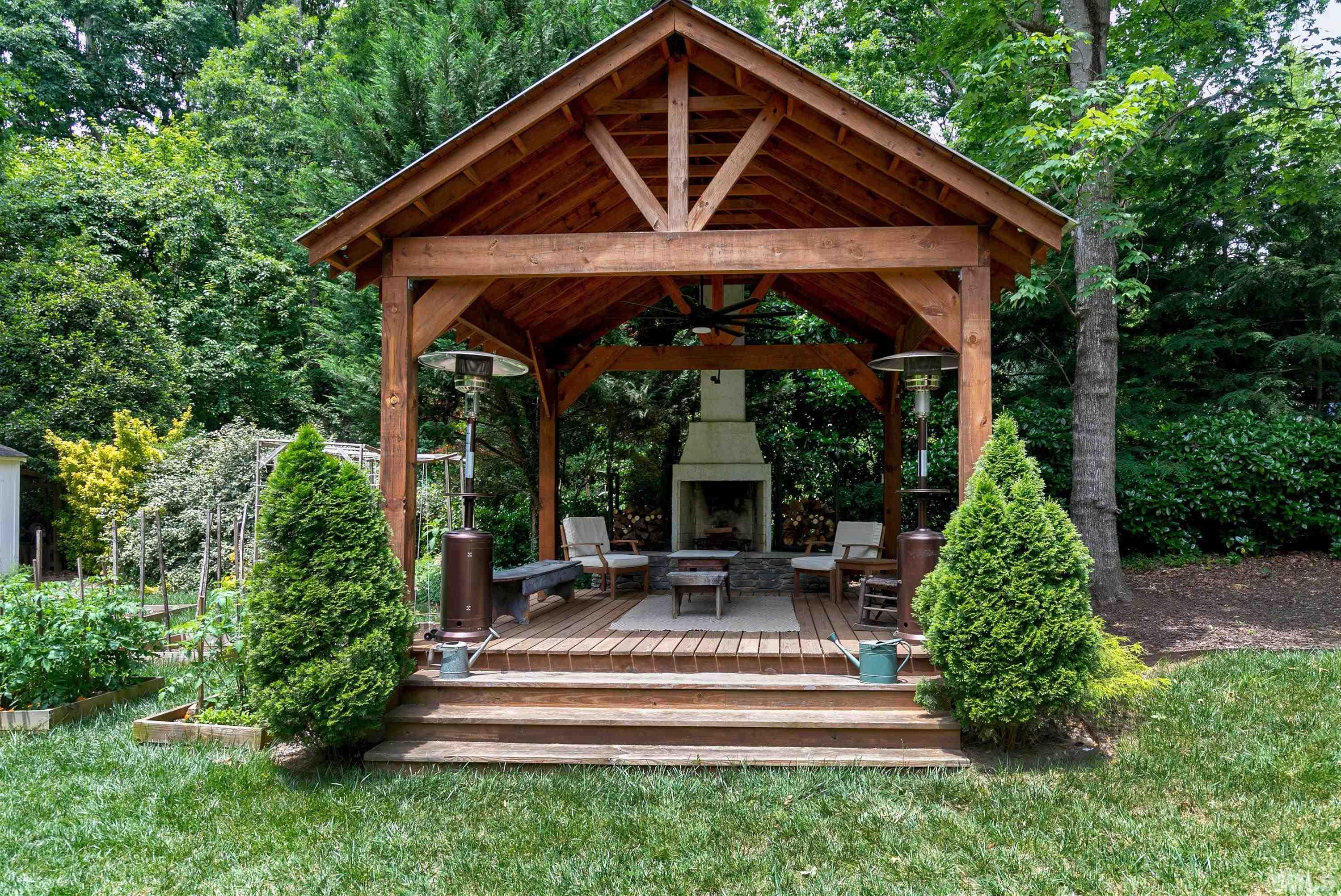 1300 Kingston Ridge Road Cary, NC 27511 - Photo 28 of 40 a view of house with porch and garden