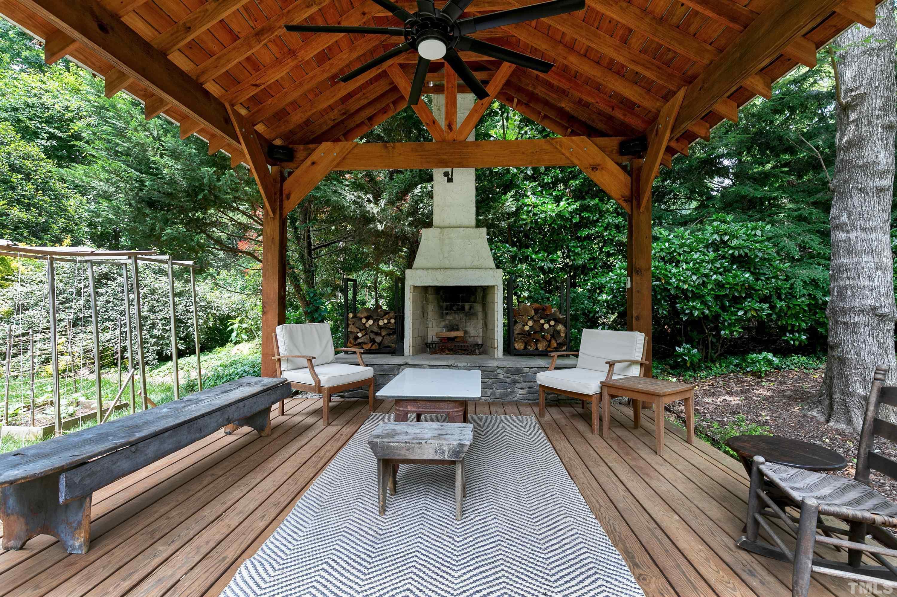 1300 Kingston Ridge Road Cary, NC 27511 - Photo 29 of 40 a view of house with backyard outdoor seating and trees