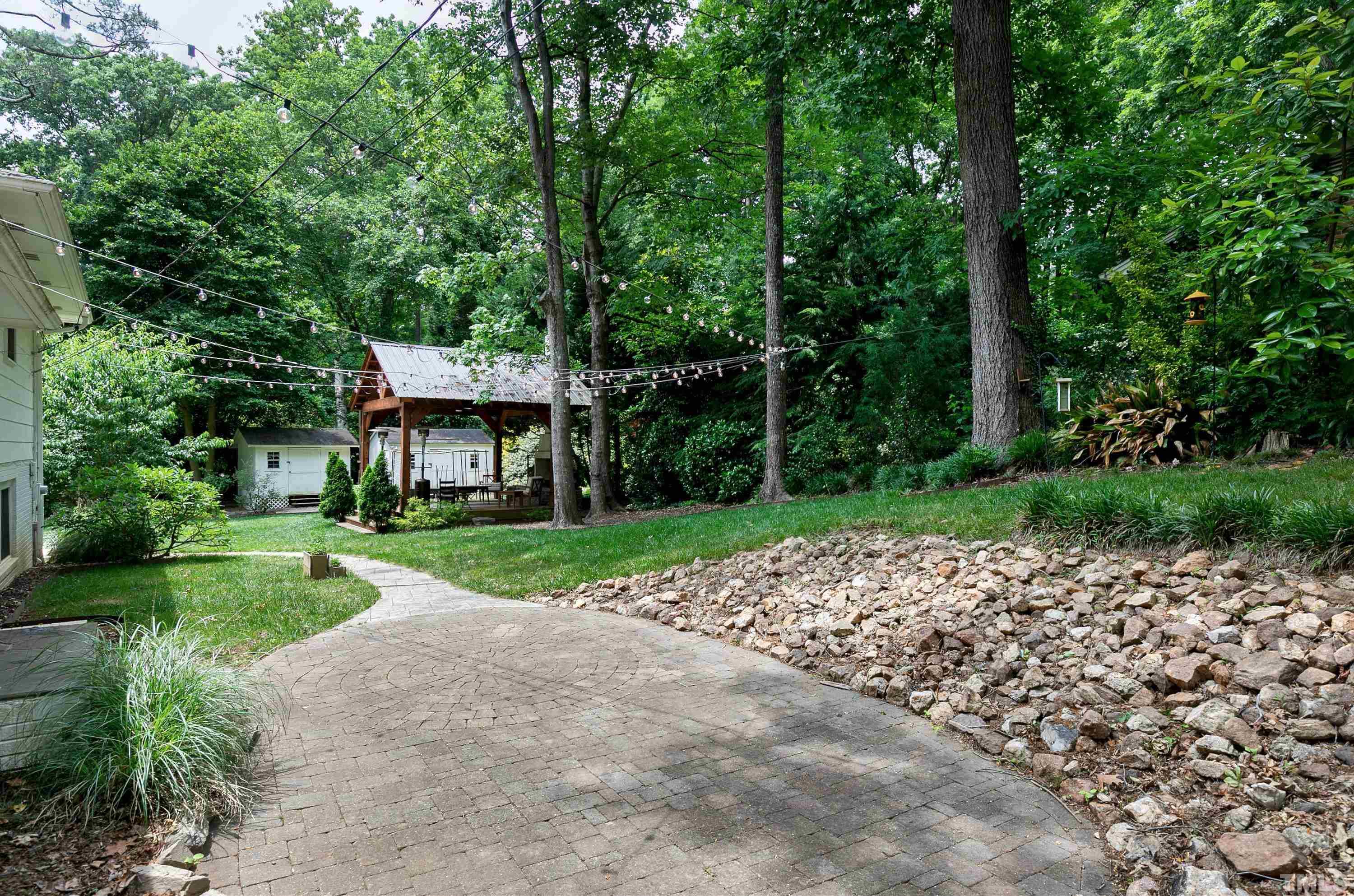 1300 Kingston Ridge Road Cary, NC 27511 - Photo 35 of 40 a view of a house with a yard