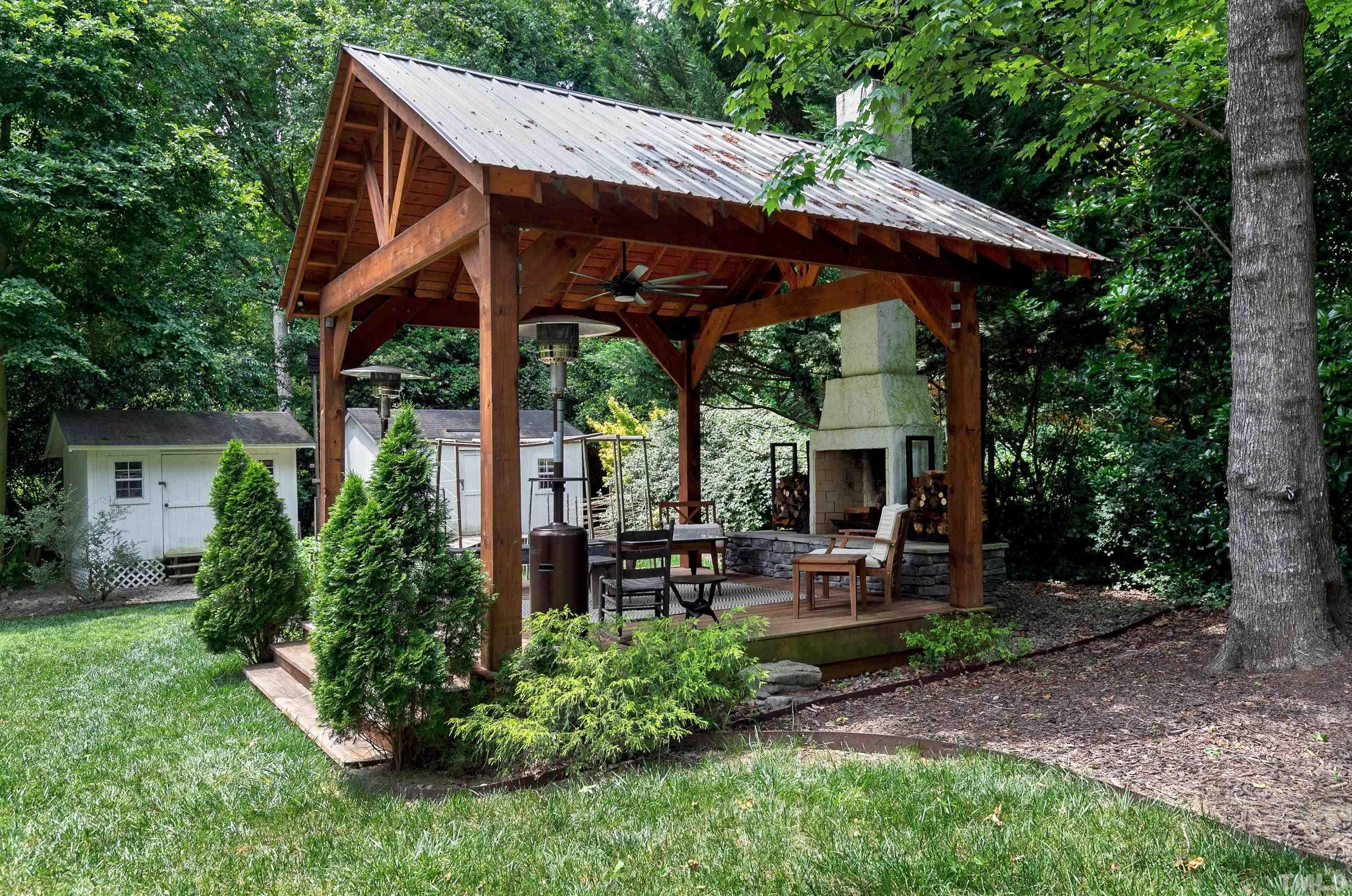 1300 Kingston Ridge Road Cary, NC 27511 - Photo 37 of 40 a patio with wooden table and chairs