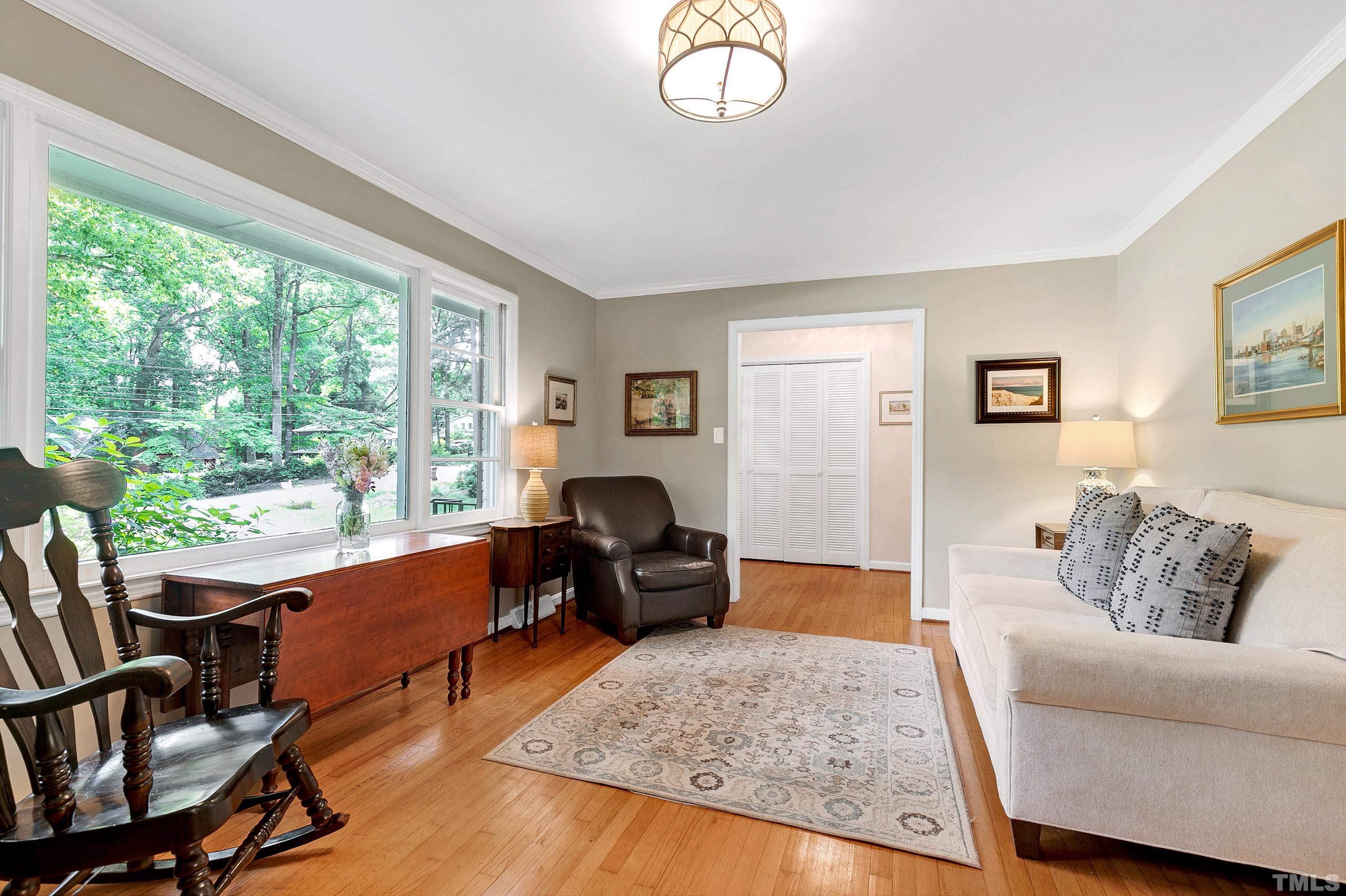 1300 Kingston Ridge Road Cary, NC 27511 - Photo 5 of 40 a living room with furniture and a large window