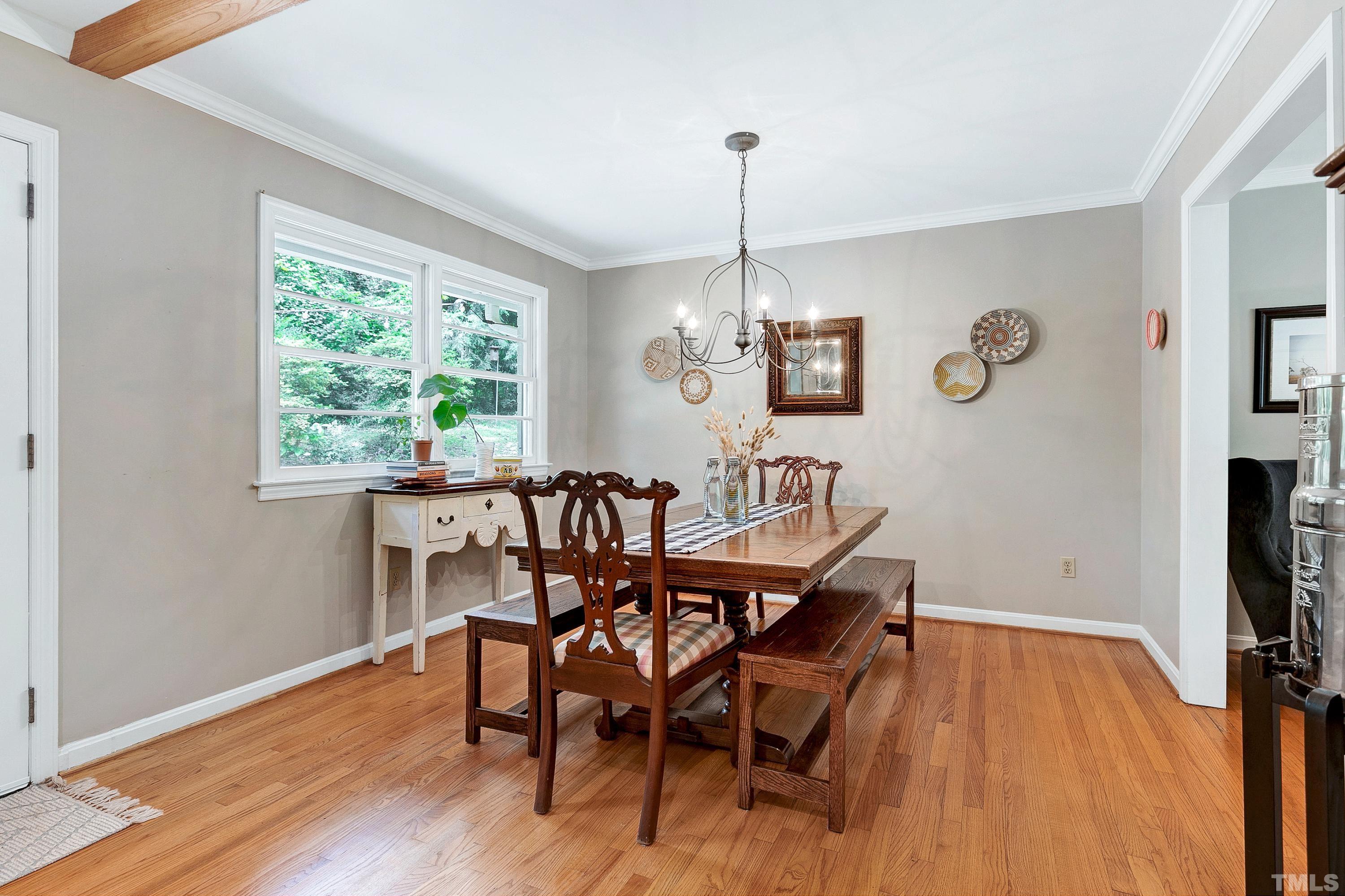 1300 Kingston Ridge Road Cary, NC 27511 - Photo 7 of 40 a view of a dining room with furniture window and wooden floor
