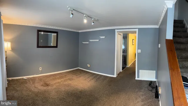 a view of an empty room with a flat screen tv