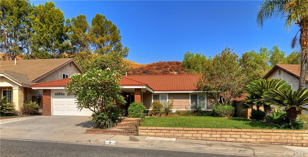 7 Sage Canyon Road Phillips Ranch, CA 91766 - Photo 1 of 1 a front view of a house with a yard