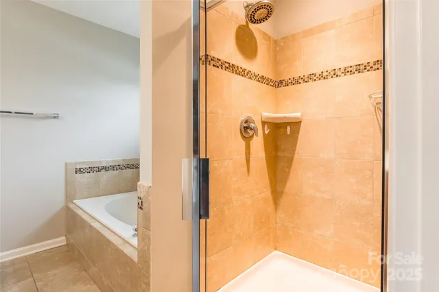 a bathroom with a mirror and a shower