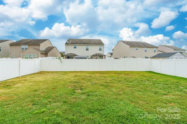a view of a big room with table and chairs