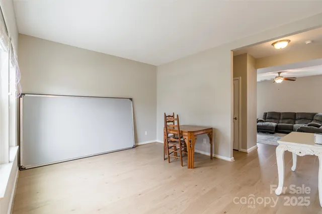 a kitchen with furniture and a refrigerator