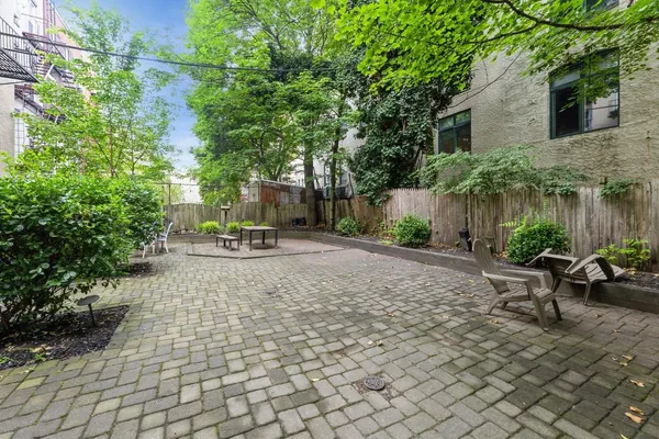 a view of a backyard with sitting area