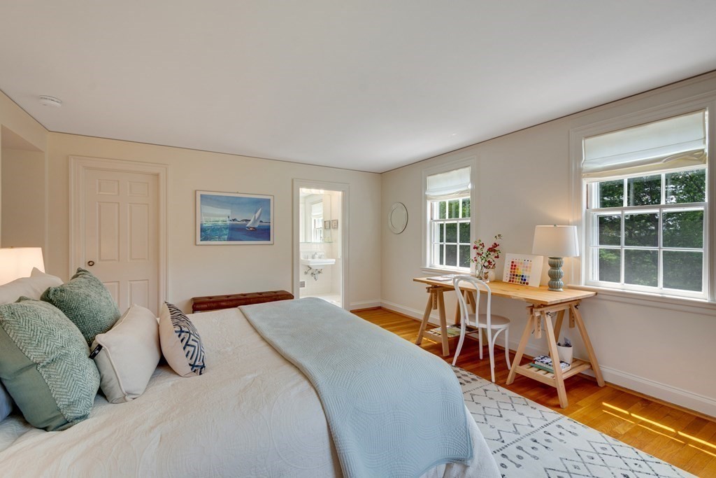 35 Sandy Pond Road Lincoln, MA 01773 - Photo 22 of 40 a bed room with a bed and a table