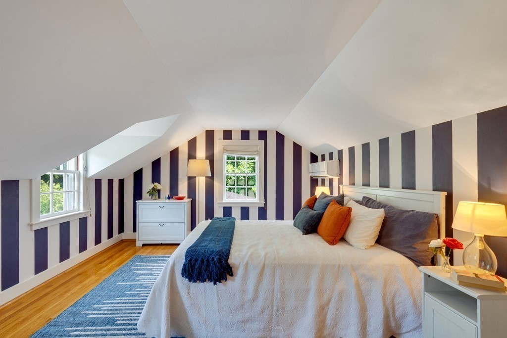 35 Sandy Pond Road Lincoln, MA 01773 - Photo 25 of 40 a bed sitting in a bedroom next to a window