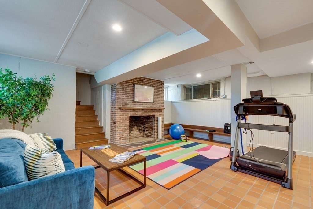 35 Sandy Pond Road Lincoln, MA 01773 - Photo 26 of 40 a living room with furniture and a fireplace