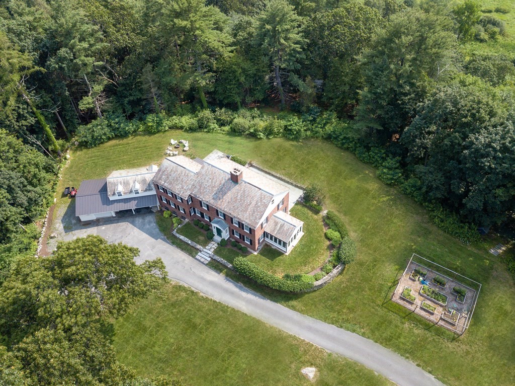 35 Sandy Pond Road Lincoln, MA 01773 - Photo 35 of 40 an aerial view of a house with swimming pool a yard and a fountain