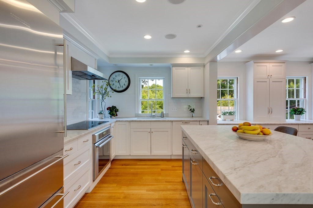 35 Sandy Pond Road Lincoln, MA 01773 - Photo 6 of 40 a kitchen with stainless steel appliances granite countertop a sink and cabinets