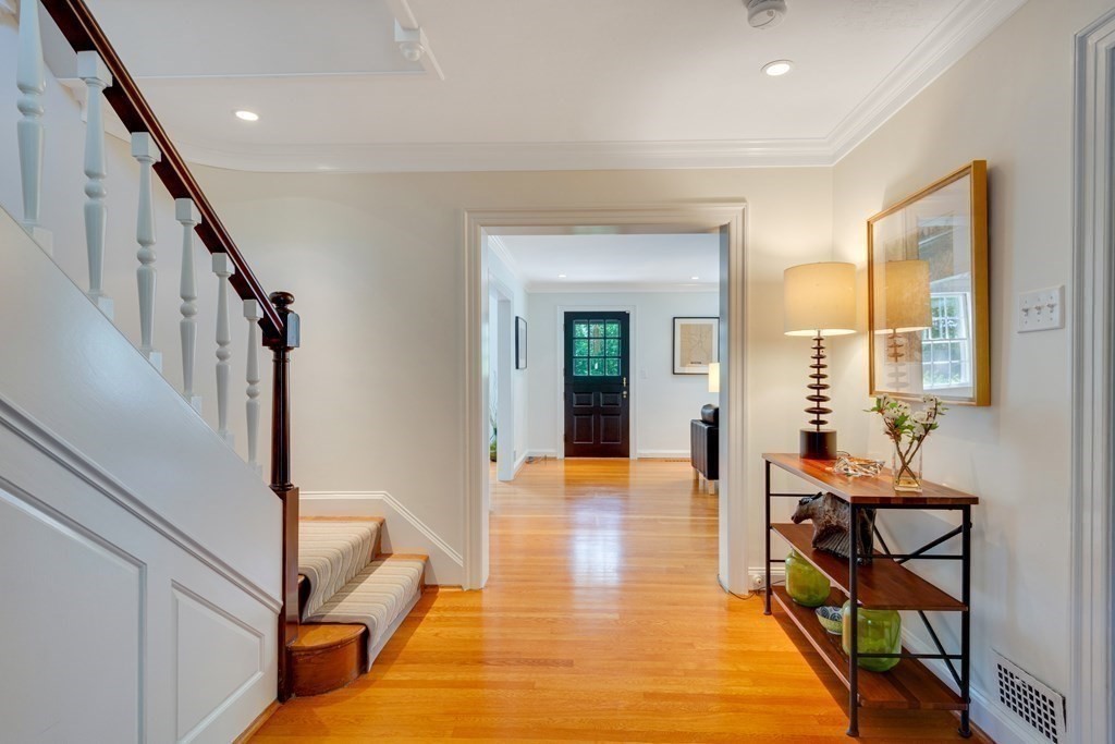 35 Sandy Pond Road Lincoln, MA 01773 - Photo 9 of 40 a view of a hallway with furniture and floor to ceiling window