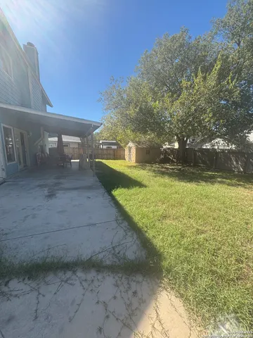 a view of a yard with an outdoor space