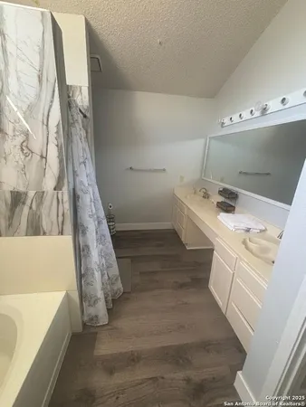 a bathroom with a sink and a bathtub