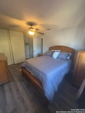 a bedroom with a bed and a mirror
