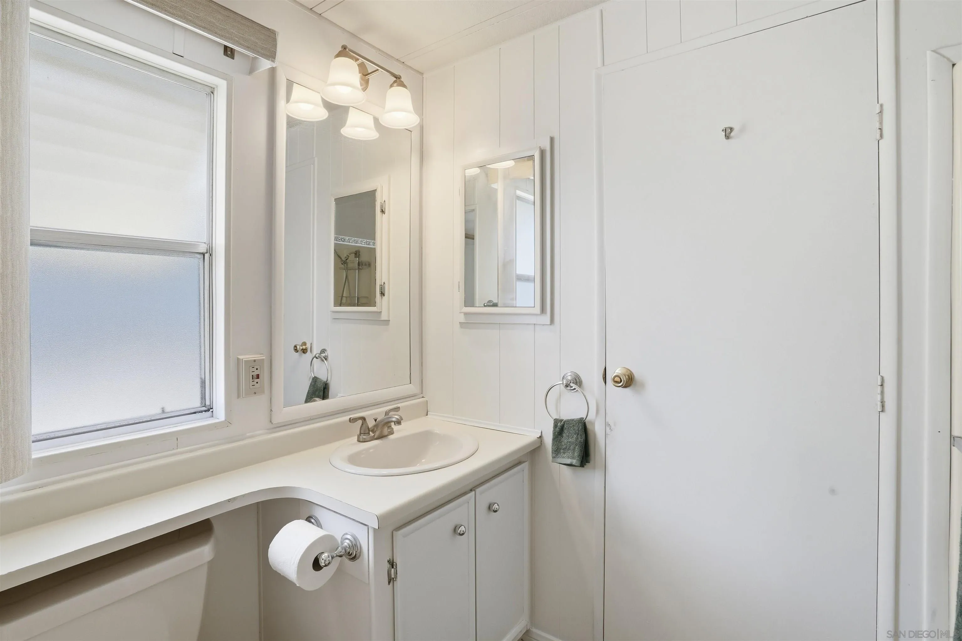 9255 North Magnolia Avenue, Unit 339 Santee, CA 92071 - Photo 35 of 51 a bathroom with a sink and a mirror