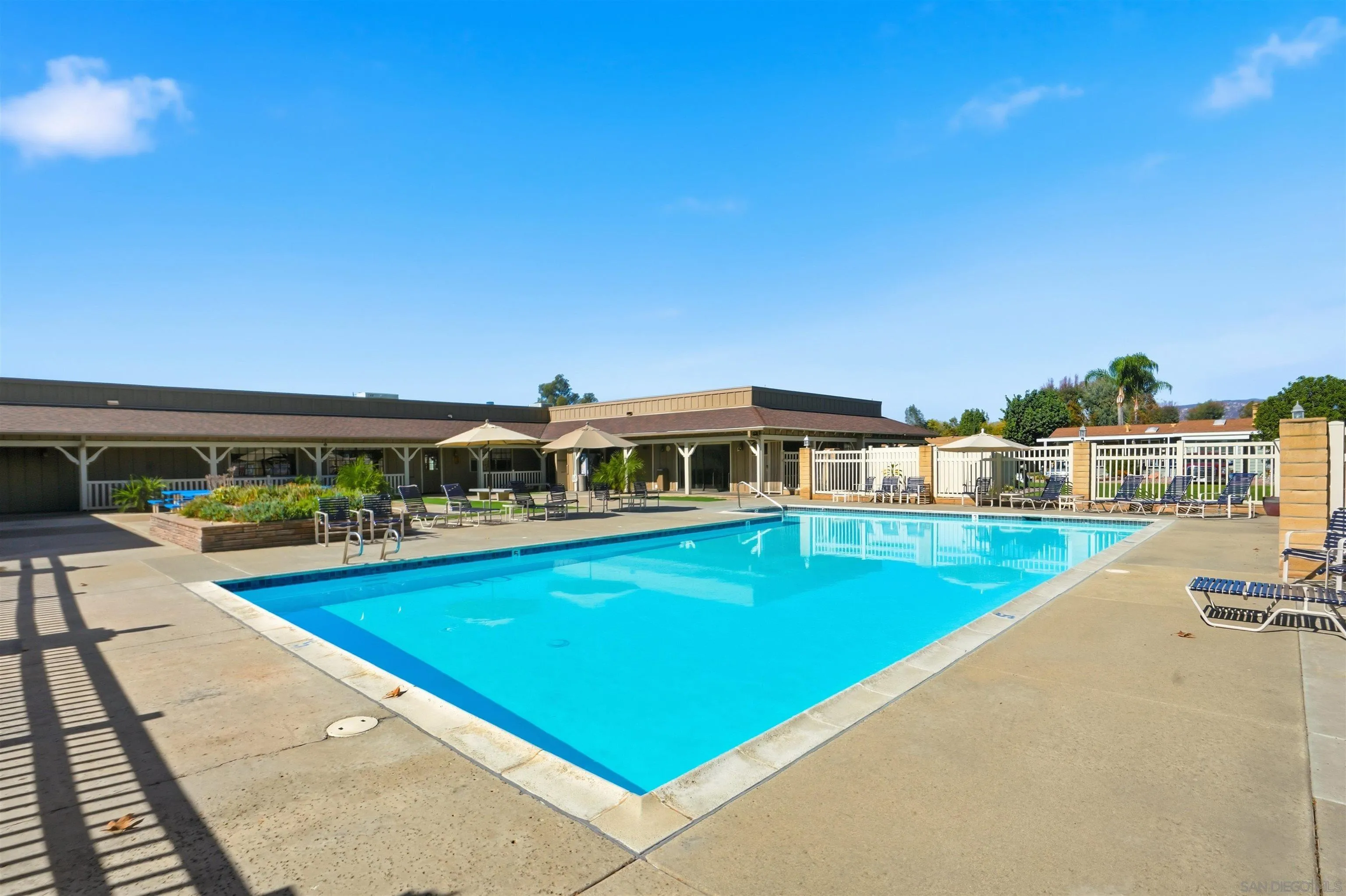9255 North Magnolia Avenue, Unit 339 Santee, CA 92071 - Photo 39 of 51 a view of a house with pool and chairs