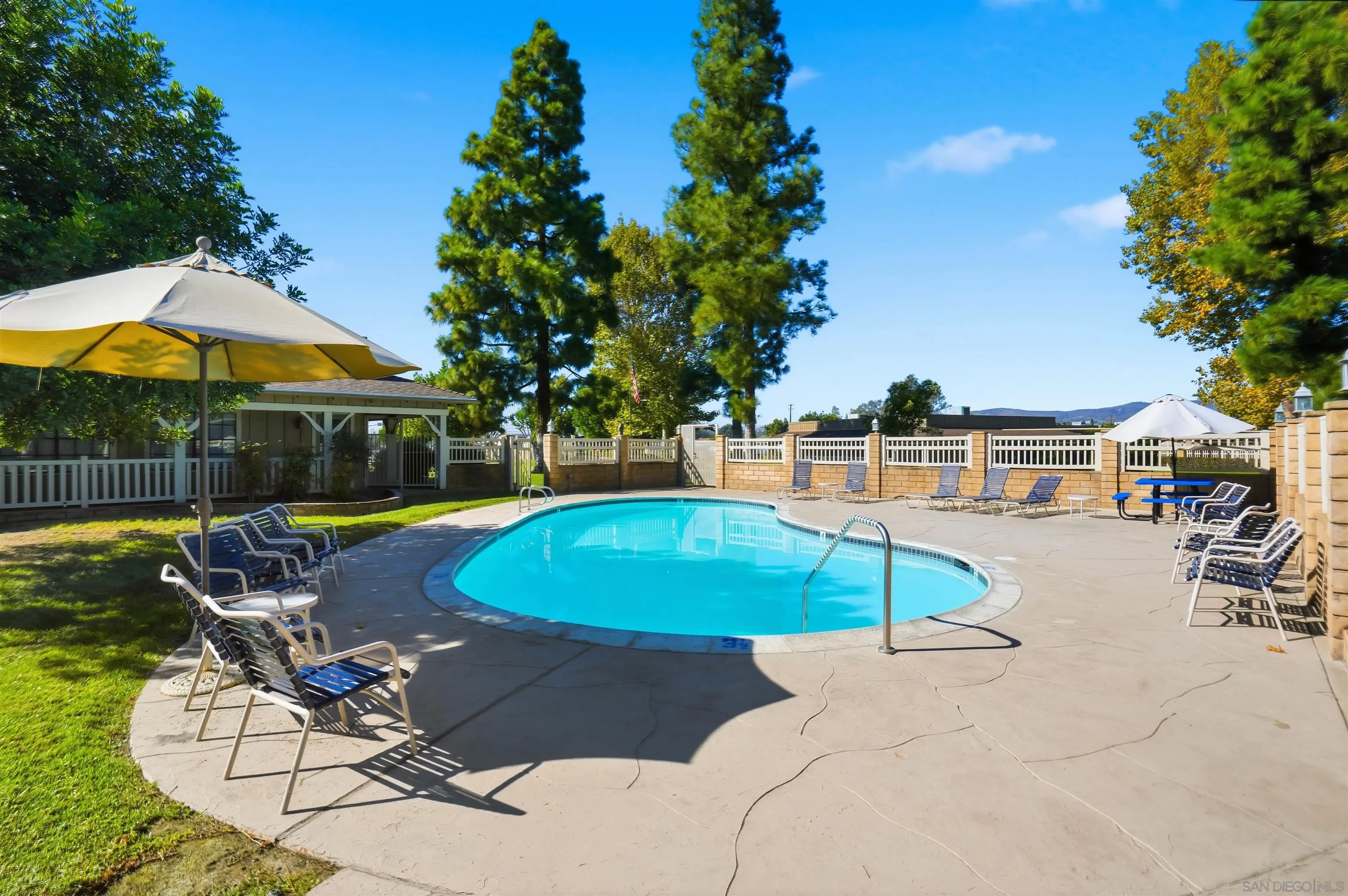 9255 North Magnolia Avenue, Unit 339 Santee, CA 92071 - Photo 46 of 51 a view of a swimming pool with lounge chairs