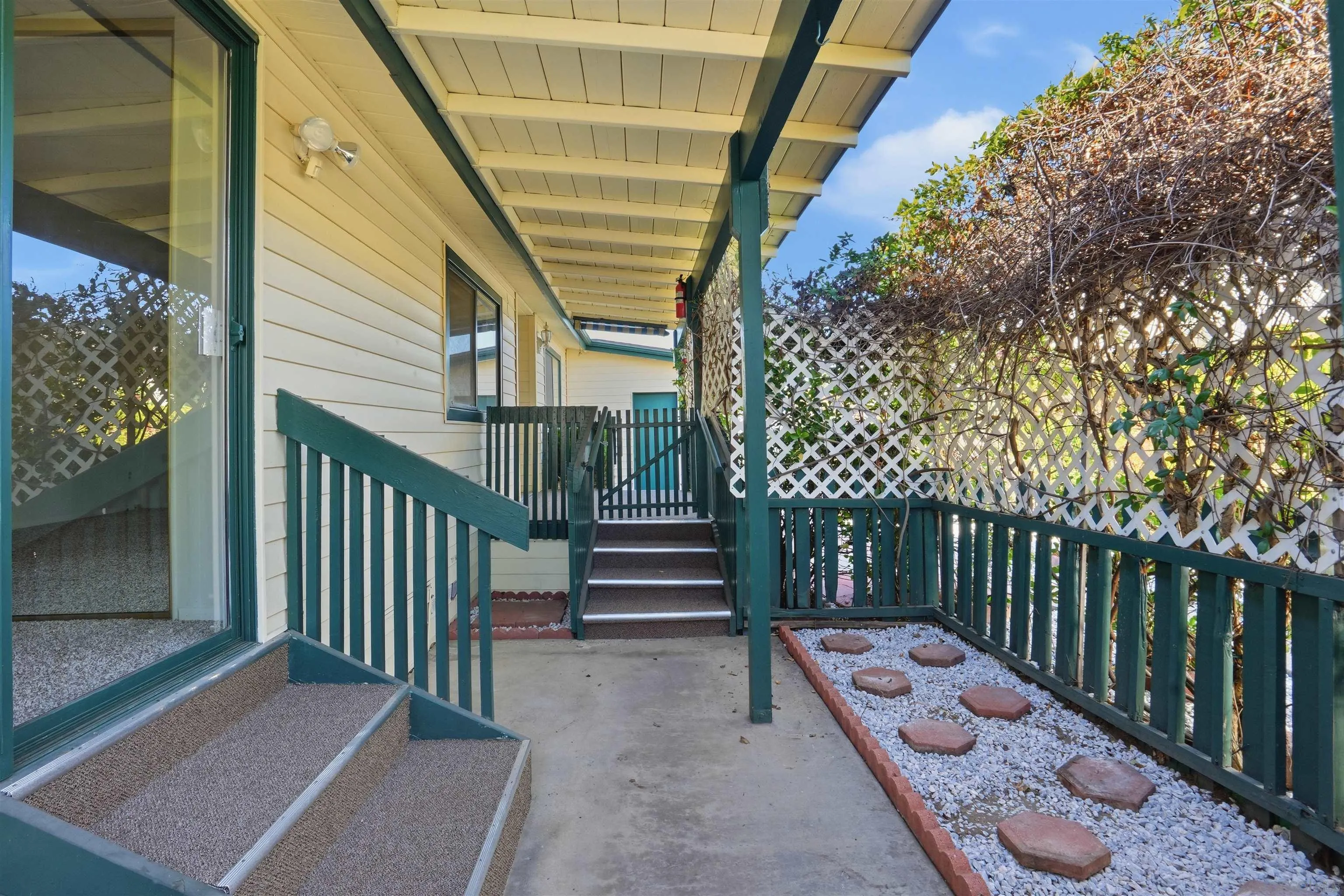 9255 North Magnolia Avenue, Unit 339 Santee, CA 92071 - Photo 7 of 51 a view of a wooden door with a bench