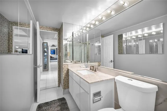 a bedroom with a bed and a night stand