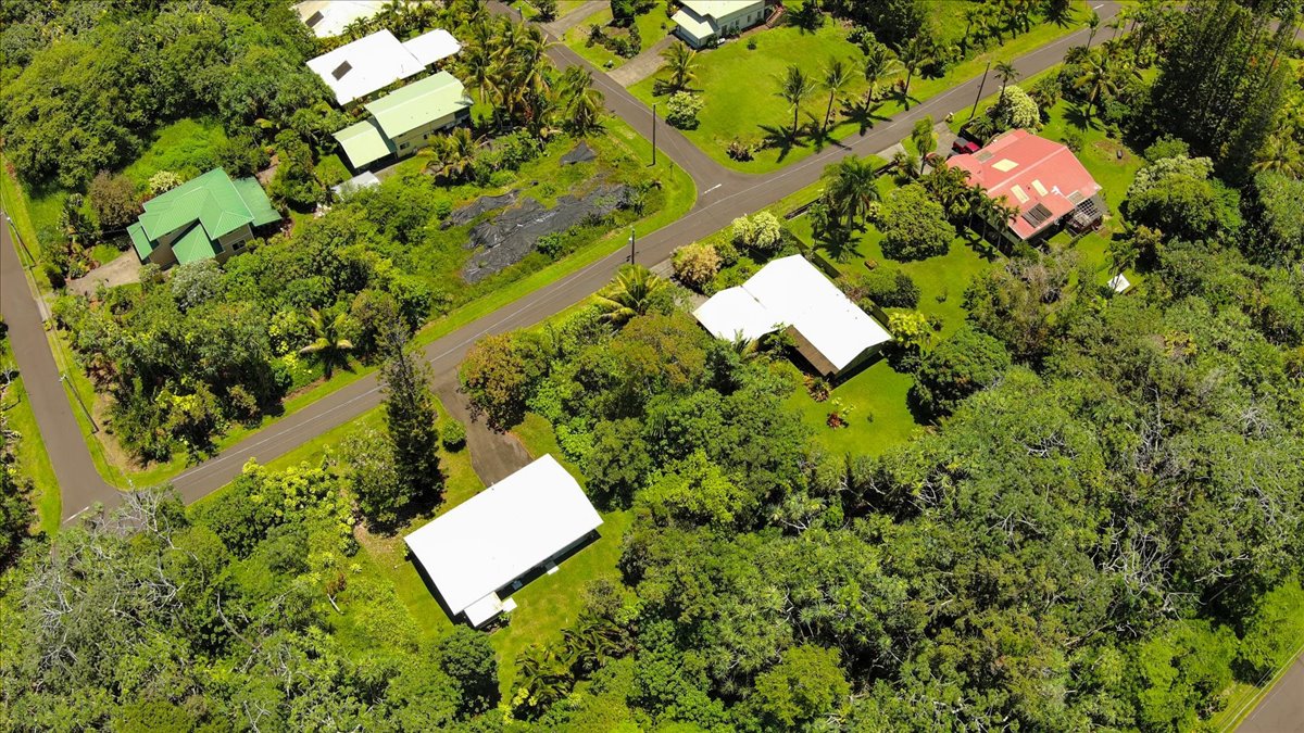 15-175 North Lot 1763 Puni Lapa Loop Pahoa, HI 96778 - Photo 16 of 18 an aerial view of a house with a yard and lake view