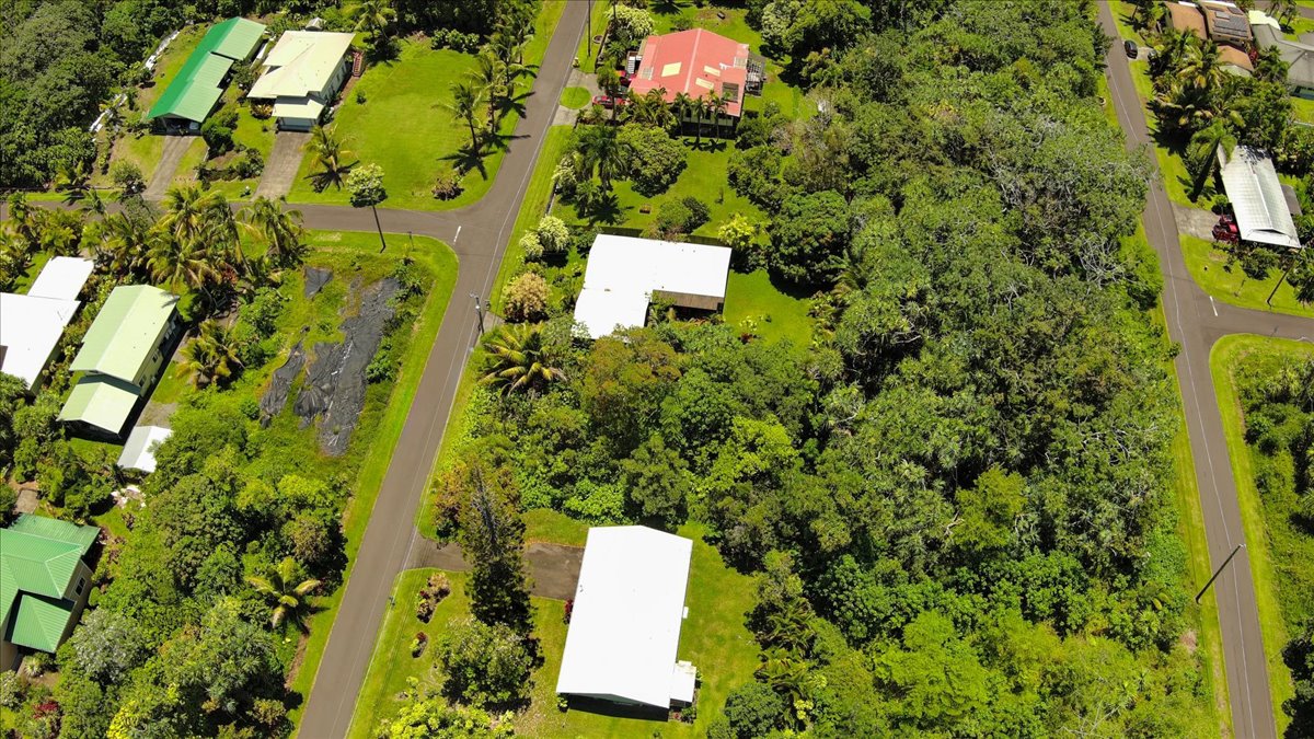 15-175 North Lot 1763 Puni Lapa Loop Pahoa, HI 96778 - Photo 17 of 18 an aerial view of a house with a yard and swimming pool