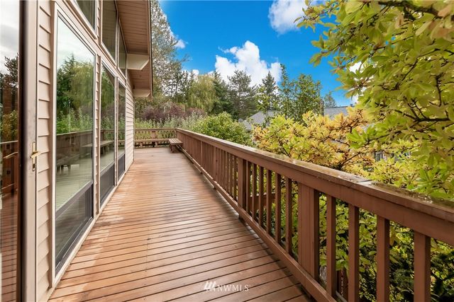 a view of balcony with wooden floor