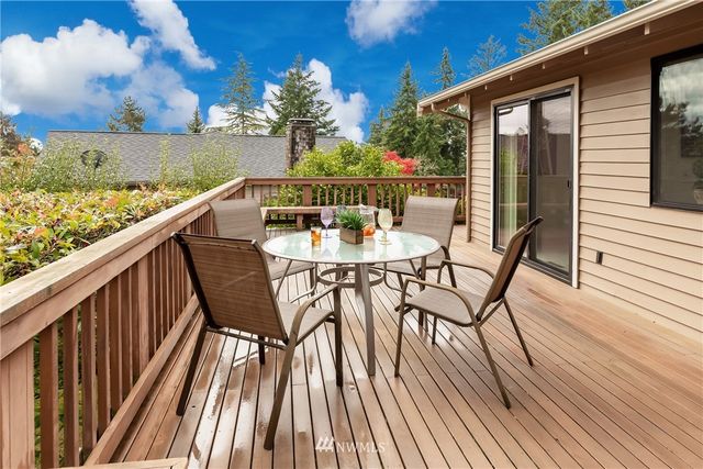 a view of balcony with furniture and wooden floor