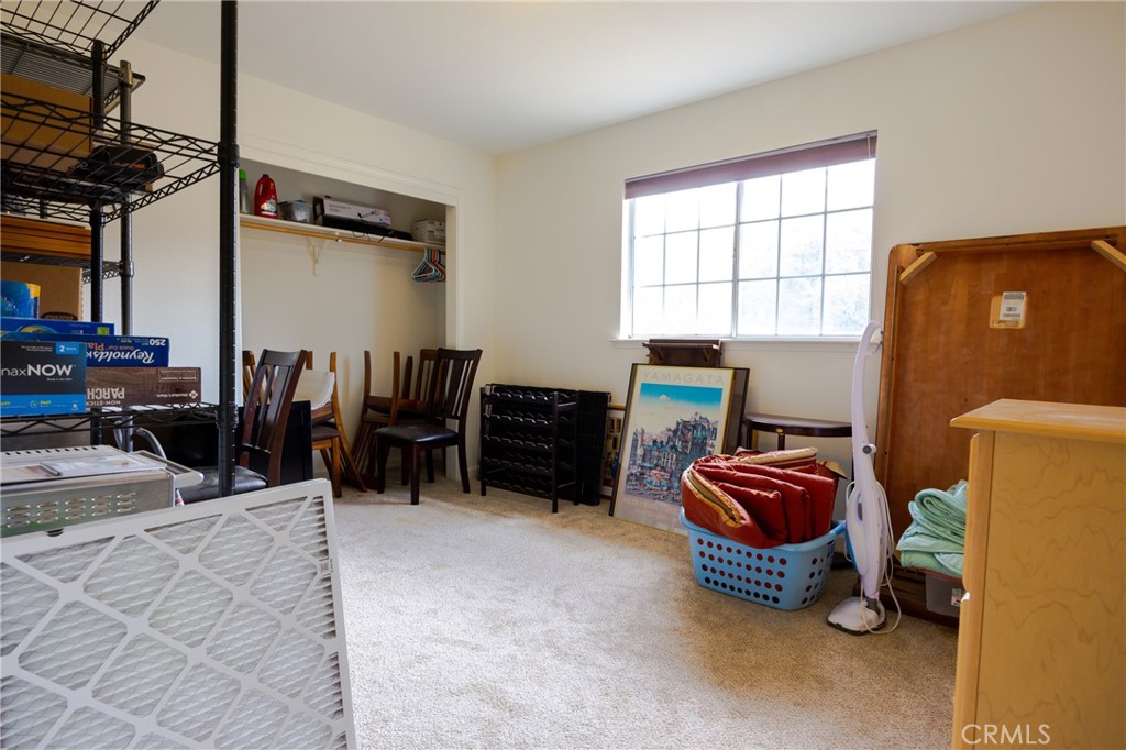 30142 Revis Road Coarsegold, CA 93614 - Photo 26 of 43 a bedroom with furniture and a bed