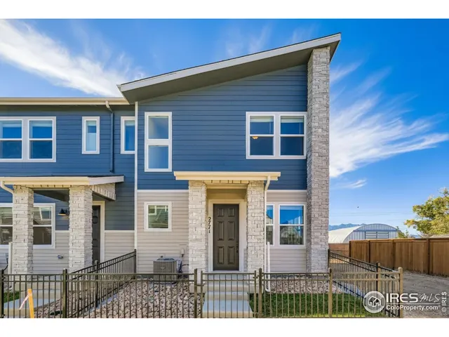 a lobby with furniture and floor to ceiling window