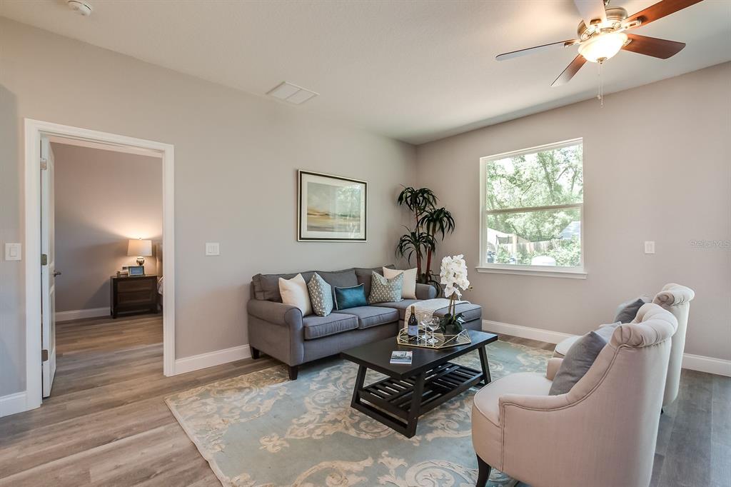 621 Paddock Street Orlando, FL 32833 - Photo 13 of 25 a living room with furniture and a large window