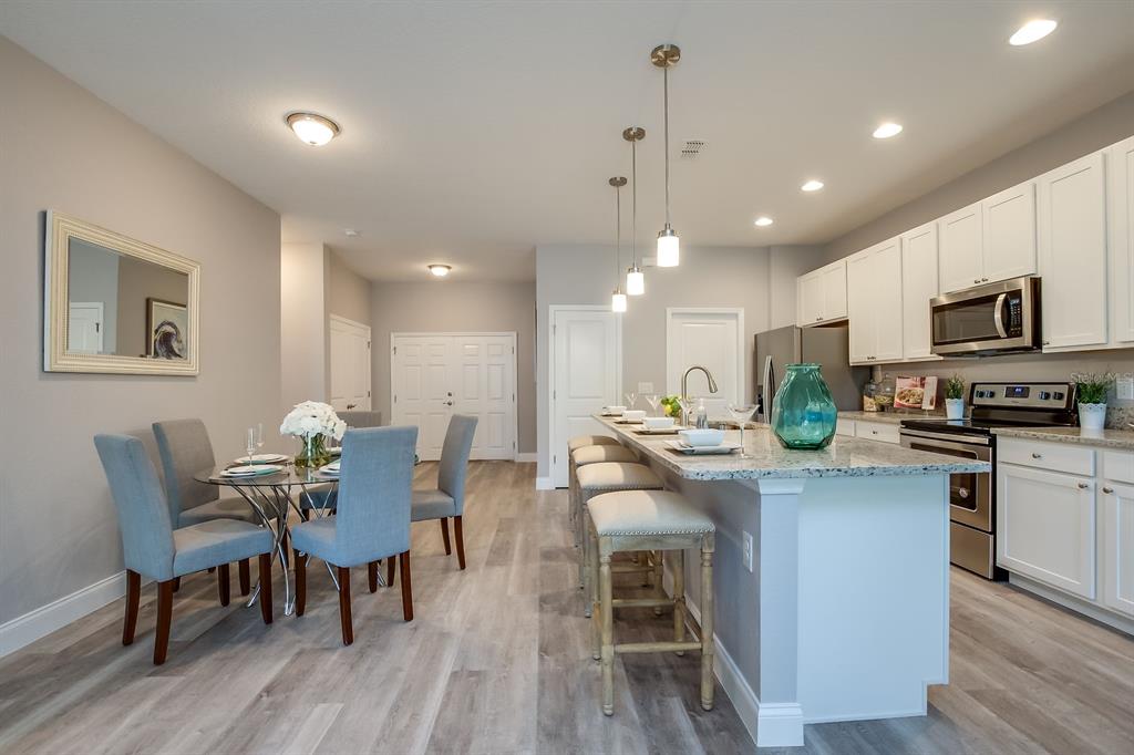 621 Paddock Street Orlando, FL 32833 - Photo 15 of 25 a view of a dining room with furniture and wooden floor