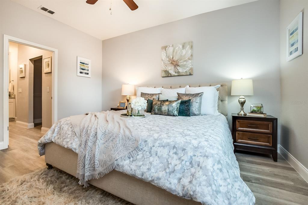 621 Paddock Street Orlando, FL 32833 - Photo 17 of 25 a bedroom with a bed and painting on the wall