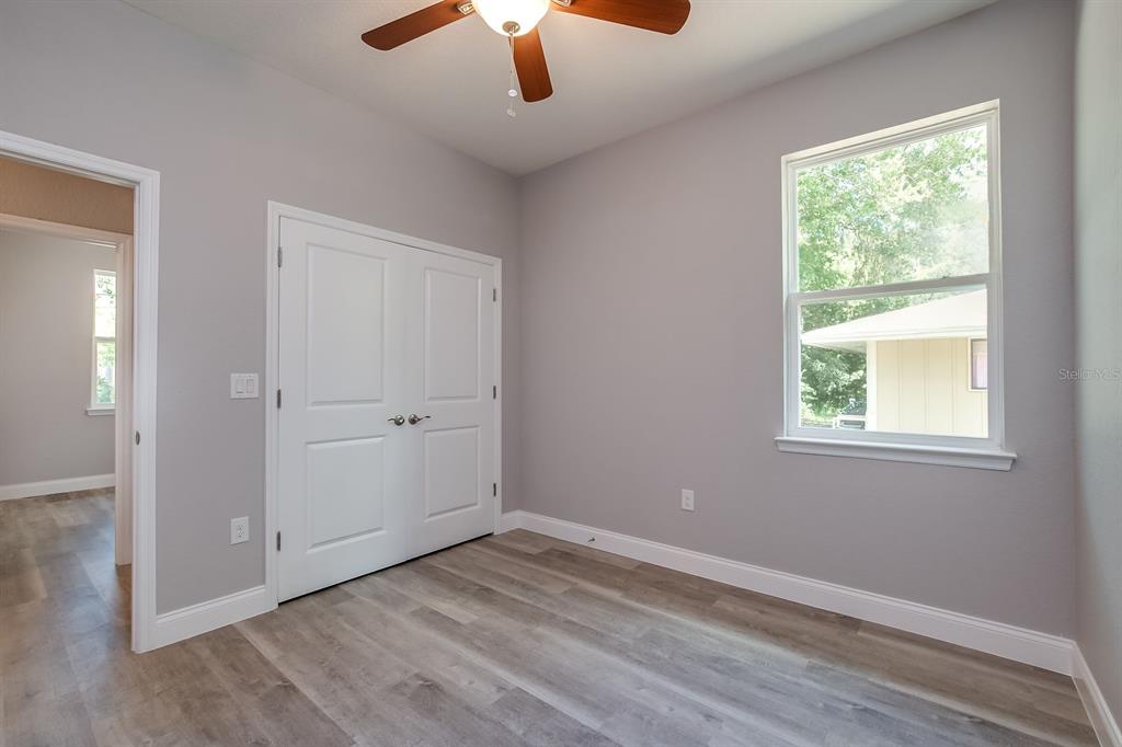 621 Paddock Street Orlando, FL 32833 - Photo 20 of 25 an empty room with a window and a ceiling fan