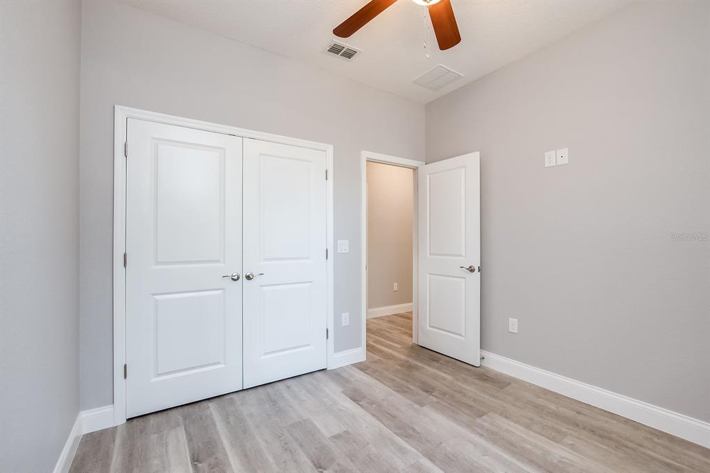 621 Paddock Street Orlando, FL 32833 - Photo 21 of 25 an empty room with ceiling fan