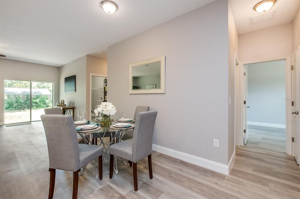 621 Paddock Street Orlando, FL 32833 - Photo 6 of 25 a view of a dining room with furniture and wooden floor