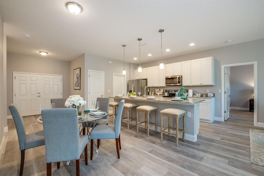 621 Paddock Street Orlando, FL 32833 - Photo 8 of 25 a view of a dining room with furniture and wooden floor
