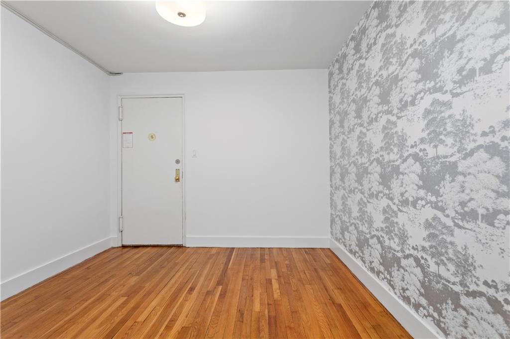 9511 Shore Road, Unit 101 Brooklyn, NY 11209 - Photo 2 of 8 a view of a room with wooden floor
