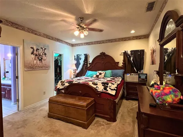 a living room with furniture a flat screen tv and a chandelier