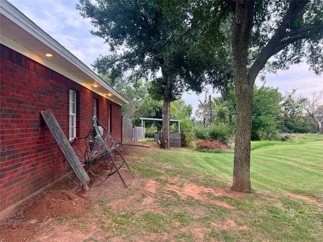 a view of a couches in backyard of house