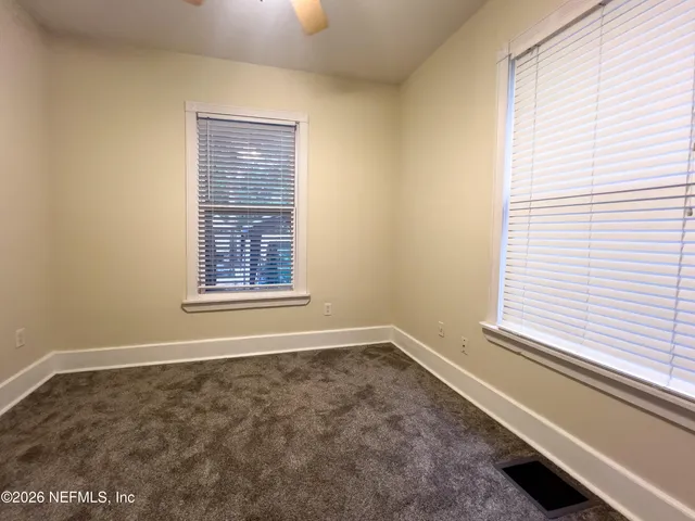 a view of a room that has a window in it