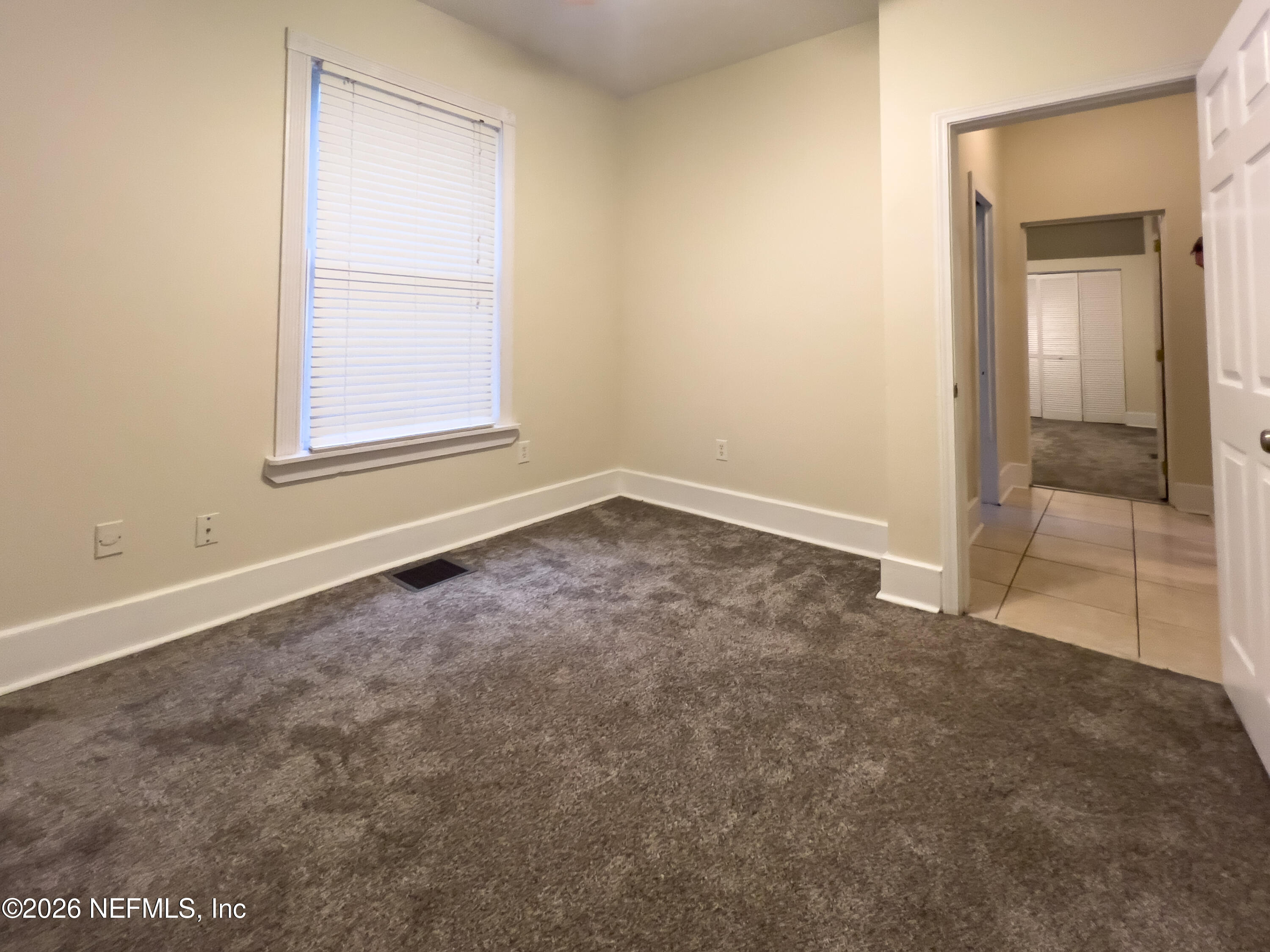 1425 Silver Street Jacksonville, FL 32206 - Photo 14 of 20 an empty room with windows