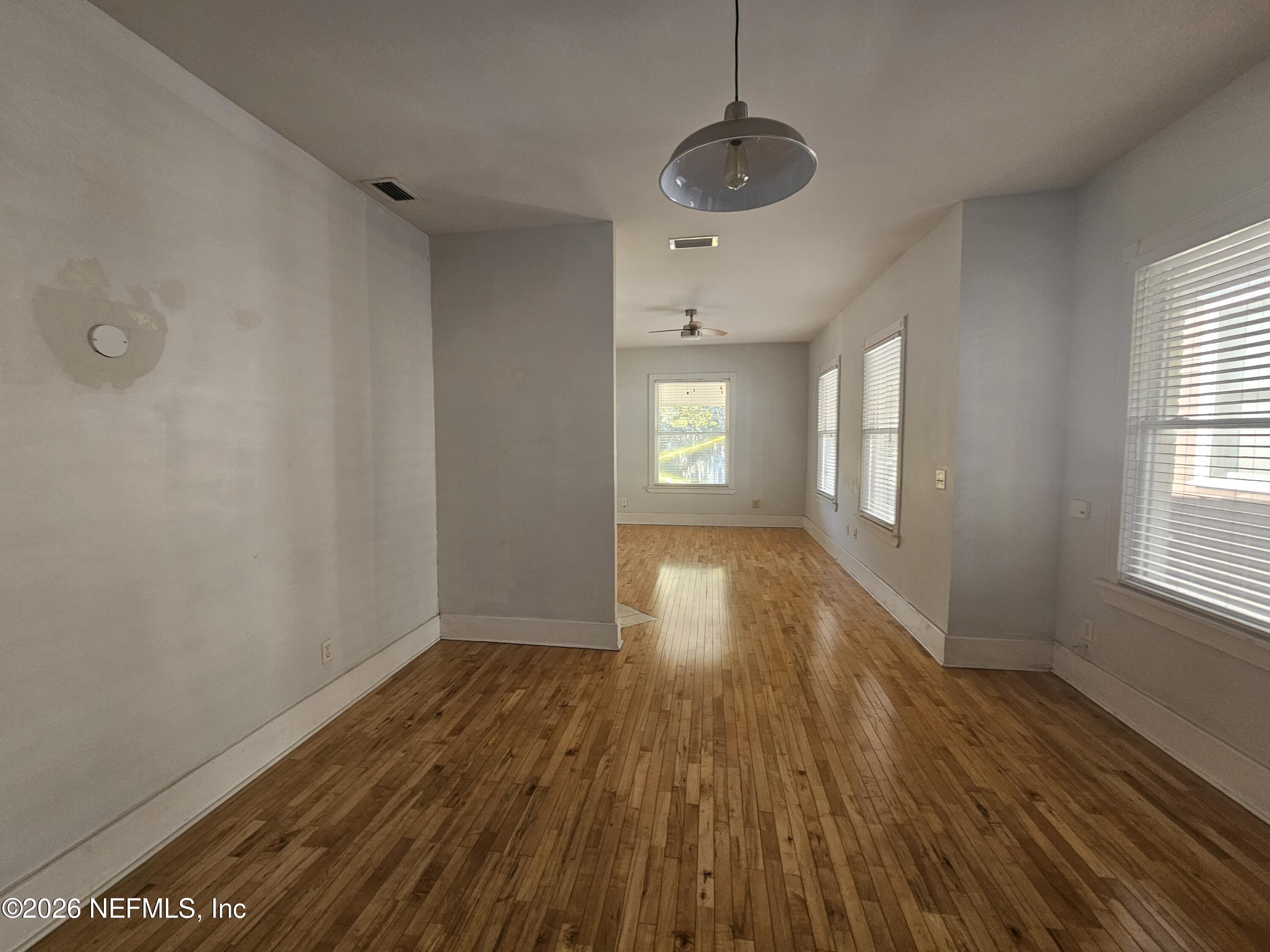 1425 Silver Street Jacksonville, FL 32206 - Photo 4 of 20 a view of empty room with wooden floor and fan