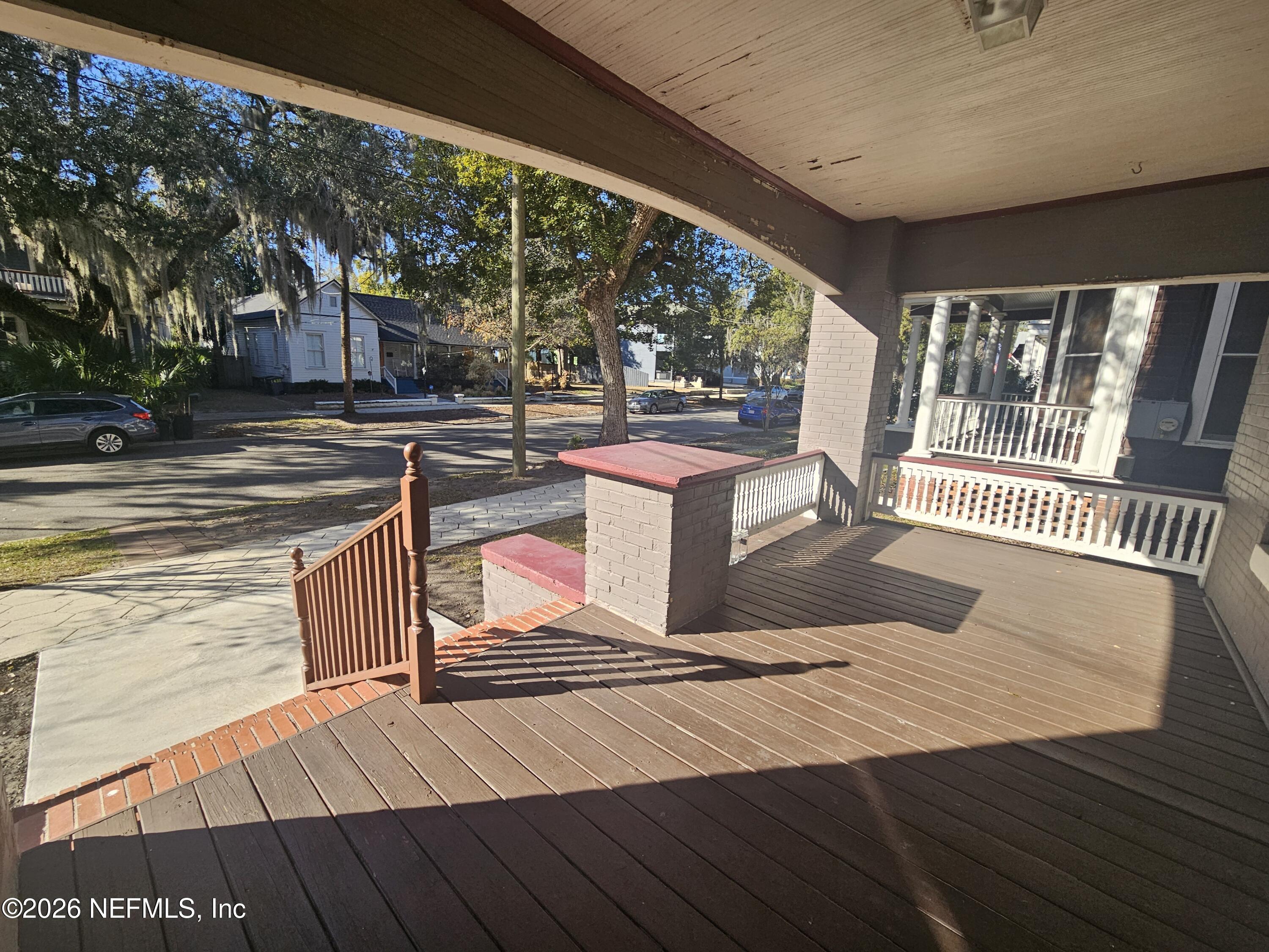 1425 Silver Street Jacksonville, FL 32206 - Photo 9 of 20 a view of a roof deck with wooden floor and fence
